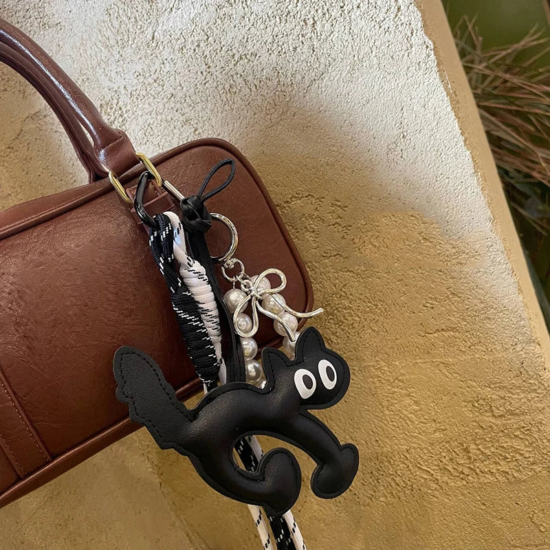 Bag Charm Chat en Cuir